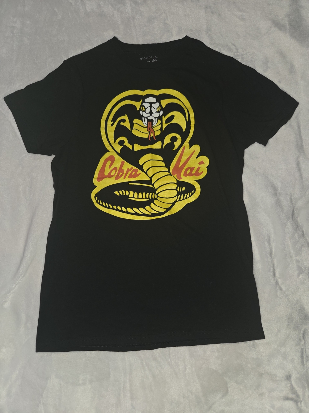 Bioworld Cobra Kai Black Tee with Yellow & Red Cobra Graphic